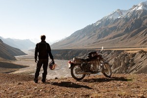 complete a motorbike tour around the world